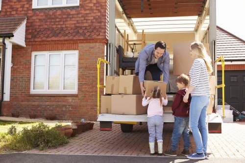 Professional flat removals team handling apartment furniture in Peckham
