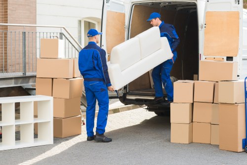 Small removals van loaded for a move in Peckham street